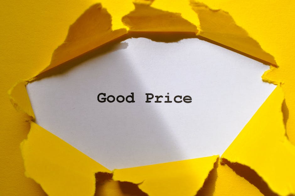 A white card with the words 'Good Price' typed in black appears through a torn yellow paper background, creating a visual emphasis on the message. The torn edges of the yellow paper reveal the message